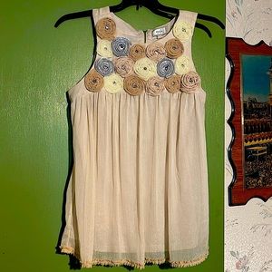 Color: Vanilla Baby Doll top with rose designs on upper area.